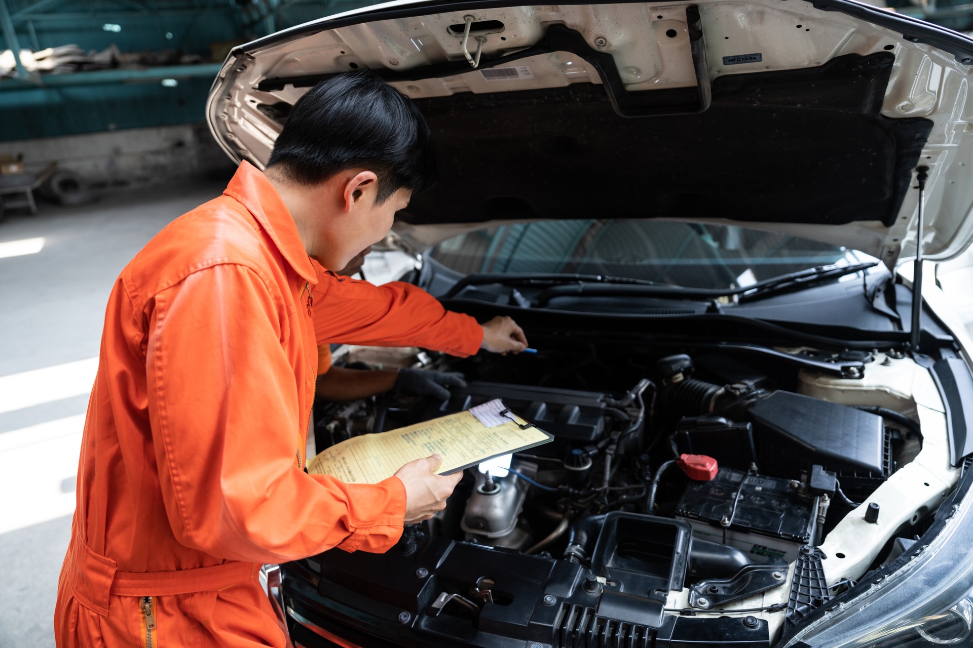 Automotive service mechanic inspect and diagnose car engine. Oxus